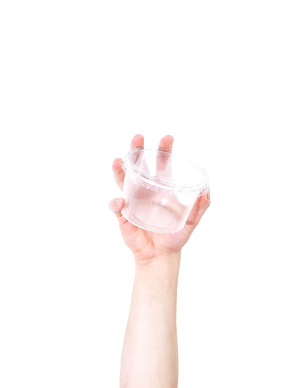 Hand holding a clear plastic container